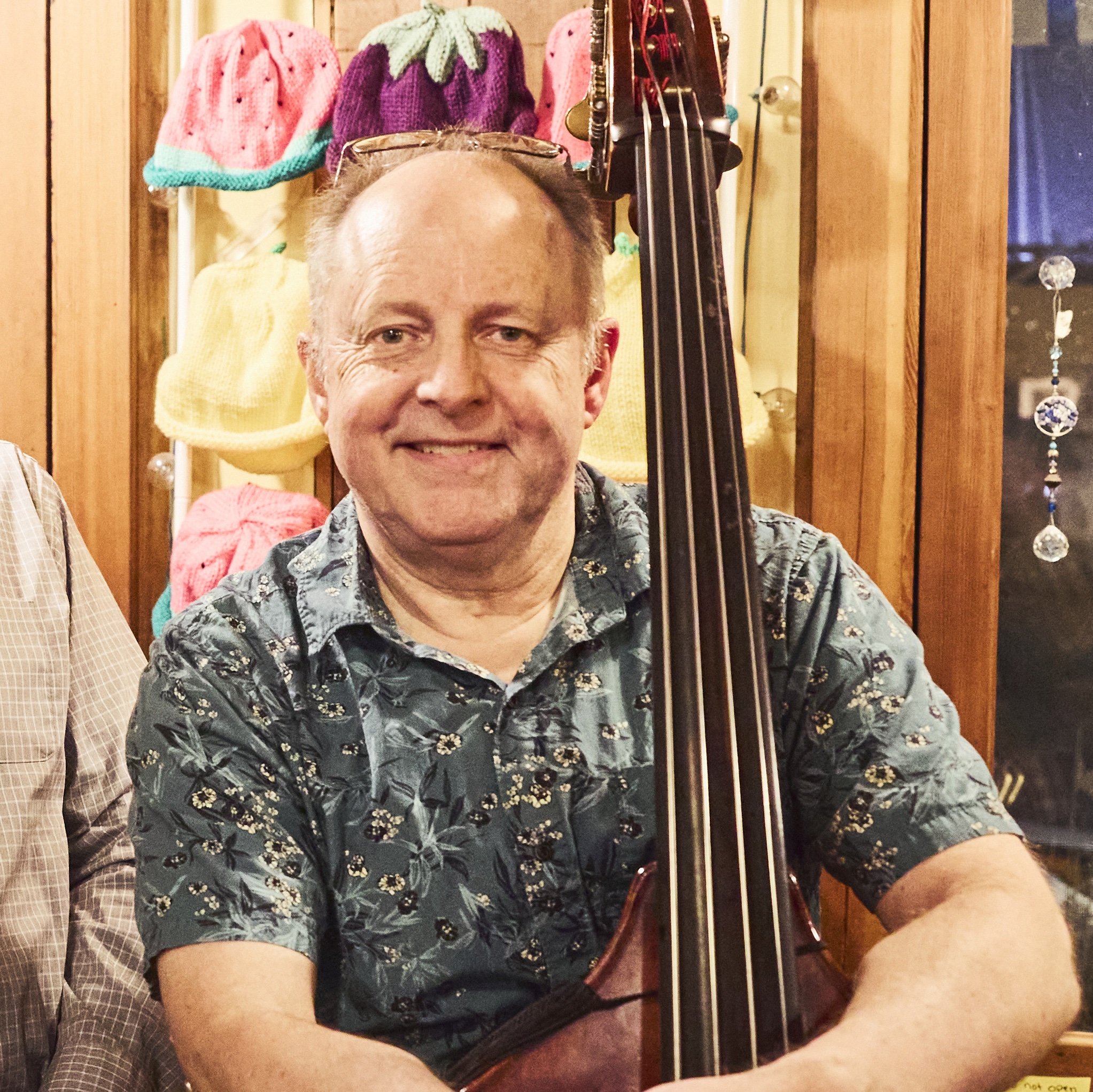 Dan smiling for the camera playing the bass.